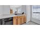 Bright kitchen featuring wood cabinets, stainless steel sink and tile floors at 4106 Waterside Island Ct, Tampa, FL 33617