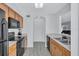 Clean kitchen featuring black appliances, tile floors and wood cabinets at 4106 Waterside Island Ct, Tampa, FL 33617