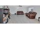 Spacious living room with modern floors and comfortable leather furniture at 4106 Waterside Island Ct, Tampa, FL 33617