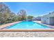 Bright blue community pool provides residents a refreshing place to swim and relax on a sunny day at 4106 Waterside Island Ct, Tampa, FL 33617