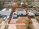 A high aerial view of the property, showing the full lot, the driveway, the backyard and the street at 4346 10Th N Ave, St Petersburg, FL 33713
