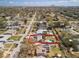 A high aerial view of the property with a swimming pool, solar panels and in relation to the neighborhood at 4346 10Th N Ave, St Petersburg, FL 33713