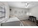 This bedroom features hard surface floors, a ceiling fan and bright windows at 4346 10Th N Ave, St Petersburg, FL 33713