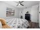 Comfortable bedroom features ceiling fan, wood-look flooring, and natural light at 4346 10Th N Ave, St Petersburg, FL 33713