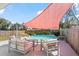 Inviting pool area with a large sunshade and outdoor seating at 4346 10Th N Ave, St Petersburg, FL 33713