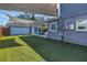 Enjoy a great backyard with a covered outdoor seating area, a green yard, and an inground pool at 4514 W Beachway Dr, Tampa, FL 33609