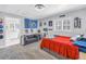Cozy bedroom with a pull-out sofa, a desk, and an en-suite bathroom at 4514 W Beachway Dr, Tampa, FL 33609