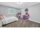 Bright bedroom with a playful design, featuring a desk, toys, and a cozy single bed at 4514 W Beachway Dr, Tampa, FL 33609