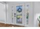 Elegant front door with intricate glass design, enhancing the home's curb appeal and providing a stylish entry at 4514 W Beachway Dr, Tampa, FL 33609