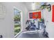 The home gym has a great view of the green turf and lush landscaping in the backyard at 4514 W Beachway Dr, Tampa, FL 33609