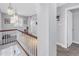 Upper hallway features a staircase with modern lighting and neutral decor at 4514 W Beachway Dr, Tampa, FL 33609