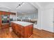 Bright kitchen with stainless steel appliances and a wooden island, open to a dining area at 4514 W Beachway Dr, Tampa, FL 33609