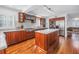 Modern kitchen featuring cherry wood cabinets, stainless steel appliances, and a bright island at 4514 W Beachway Dr, Tampa, FL 33609