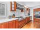Kitchen featuring cherry wood cabinets, granite countertops, and stainless steel appliances at 4514 W Beachway Dr, Tampa, FL 33609