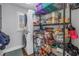 Organized pantry and laundry area with shelving for ample storage and a stacked washer and dryer at 4514 W Beachway Dr, Tampa, FL 33609