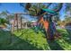 Have fun in this backyard on a playset with climbing wall, swings, and green turf at 4514 W Beachway Dr, Tampa, FL 33609