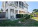 Well-maintained backyard featuring a spiral staircase to the screened in porch at 5100 Cedarbrook, Hernando Beach, FL 34607