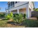 Beautiful backyard with lush tropical landscaping and shaded patio area at 5100 Cedarbrook, Hernando Beach, FL 34607