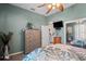 Bedroom with a patterned bedspread, neutral carpet, and an open doorway to another room at 5100 Cedarbrook, Hernando Beach, FL 34607