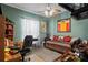 Bedroom featuring a trundle bed, tropical ceiling fan and window at 5100 Cedarbrook, Hernando Beach, FL 34607