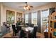 Elegant dining room featuring a stylish table setting, decorative wall art, and lots of natural light at 5100 Cedarbrook, Hernando Beach, FL 34607