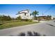 Charming two-story home features lush landscaping, an attached two-car garage, and a beautifully maintained lawn at 5100 Cedarbrook, Hernando Beach, FL 34607
