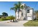 Stunning two-story home with a two-car garage, well-manicured landscaping, and a welcoming entrance at 5100 Cedarbrook, Hernando Beach, FL 34607