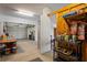 Garage featuring rolled door, shelves, paint, a workbench and assorted items at 5100 Cedarbrook, Hernando Beach, FL 34607