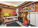 Garage featuring a workbench with assorted tools and supplies on shelves at 5100 Cedarbrook, Hernando Beach, FL 34607