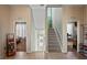Foyer with tile flooring, a staircase, and doorways to other rooms at 5100 Cedarbrook, Hernando Beach, FL 34607