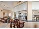 View of the kitchen with a breakfast bar adjacent to the living room and dining room at 5100 Cedarbrook, Hernando Beach, FL 34607