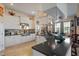 Well-equipped kitchen featuring white cabinetry, stainless steel appliances, a breakfast bar and tile flooring at 5100 Cedarbrook, Hernando Beach, FL 34607