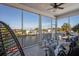 Spacious screened-in lanai with ample seating and a beautiful water view at 5100 Cedarbrook, Hernando Beach, FL 34607