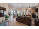 Open-concept living room with tile floors, comfortable seating, and sliding glass doors leading to the outside at 5100 Cedarbrook, Hernando Beach, FL 34607