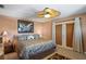 Inviting main bedroom featuring a decorative ceiling fan, neutral tones, and access to the lanai at 5100 Cedarbrook, Hernando Beach, FL 34607