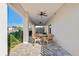 Covered outdoor patio with ceiling fans and views of the surrounding landscape at 5100 Cedarbrook, Hernando Beach, FL 34607