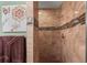 Tiled stand up shower with neutral colored tiles and decorative accents at 5100 Cedarbrook, Hernando Beach, FL 34607
