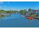 Waterfront view showcasing the dock extending out onto the canal and the surrounding waterfront community at 5100 Cedarbrook, Hernando Beach, FL 34607