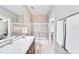 Bathroom features vanity with granite countertop, shower-tub combination, and neutral colors at 5115 Abisher Wood Ln, Brandon, FL 33511