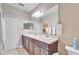 Bathroom features a double sink vanity, and vanity mirror at 5115 Abisher Wood Ln, Brandon, FL 33511