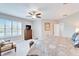 Light-filled bedroom boasts a ceiling fan and neutral paint at 5115 Abisher Wood Ln, Brandon, FL 33511