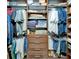 Walk-in closet boasts custom shelving and drawers, providing efficient storage solutions at 5115 Abisher Wood Ln, Brandon, FL 33511