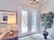 Elegant front door featuring decorative glass, complemented by a stylish lamp and potted plant at 5115 Abisher Wood Ln, Brandon, FL 33511