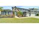 Charming two-story home featuring stone accents, a well-manicured lawn, and a two-car garage at 5115 Abisher Wood Ln, Brandon, FL 33511