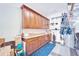 Organized garage with abundant storage, work surfaces, and tools neatly arranged at 5115 Abisher Wood Ln, Brandon, FL 33511
