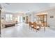 Open concept living and dining area with tile flooring, grand furniture, and natural light at 5115 Abisher Wood Ln, Brandon, FL 33511