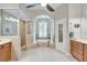 Bright and airy main bathroom features large soaking tub and glass enclosed shower at 5115 Abisher Wood Ln, Brandon, FL 33511