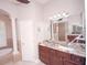 Main bathroom features double sinks with granite countertop, custom cabinets and a stand-up shower at 5115 Abisher Wood Ln, Brandon, FL 33511