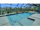 Sparkling pool area enclosed with a screened cage, providing a perfect spot for relaxation and outdoor fun at 5115 Abisher Wood Ln, Brandon, FL 33511