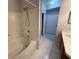 Bathroom with a shower-tub combination and tile floors at 5125 Palm Springs Blvd # 1203, Tampa, FL 33647